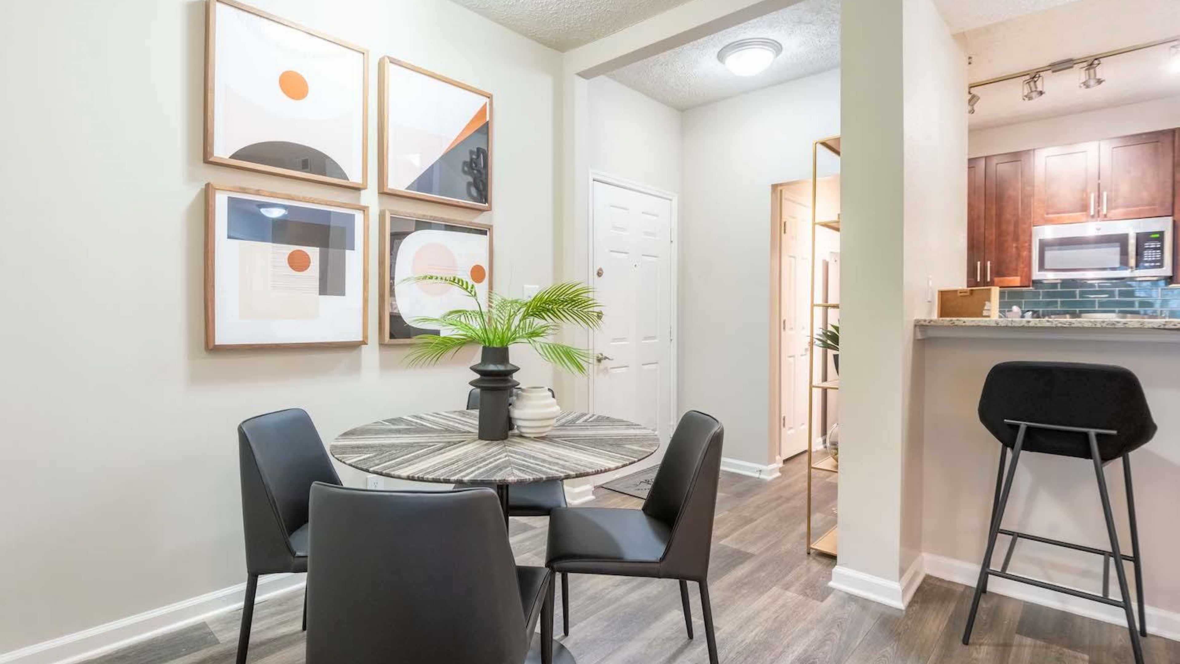 Hawthorne North Druid Hills apartment kitchen and dining space with kitchen breakfast bar and modern lighting