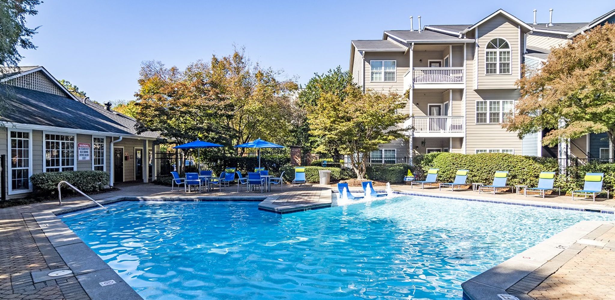 Hawthorne North Druid Hills luxury outdoor pool with in-pool lounge chairs and surrounding seating